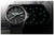 Orologio da uomo con quadrante nero e lunetta in metallo, cinturino in tessuto nero