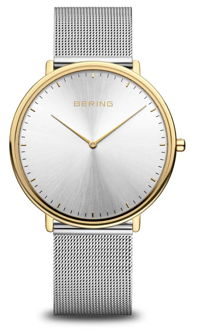 Orologio da uomo con quadrante bianco, cassa color oro e cinturino in maglia d'argento.