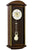 Orologio da parete con cassa in legno scuro e quadrante rotondo; pendolo a vista