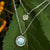 Collana a strati in argento con grande pendente rotondo in madreperla e piccolo charm scintillante