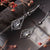 Orecchini Daydreamer con pietra, due pendenti a goccia color argento con inserto scuro