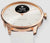 Smartwatch con lunetta color oro rosa e cinturino beige, pulsante laterale visibile, quadrante bianco.
