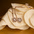 https://www.holzkern.com/media/catalog/product/8/_/8_220124_composition_gem_ohrringe_mondstein_rose_cv_4.jpg