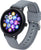 Smartwatch con display rotondo e cinturino in silicone grigio, con corona laterale
