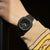 Orologio G-Shock da donna al polso: cassa nera con quadrante scuro ed elementi luminosi