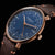 Orologio da uomo con quadrante blu, cassa color oro e cinturino in pelle marrone