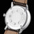 Alt text: Orologio Naos Mondphase con quadrante blu e cinturino in pelle marrone