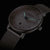 Orologio da donna Sternglas Naos: cinturino in metallo scuro, cassa argentata, quadrante scuro, lancette verdi