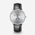 alt="Orologio Naos Moon Phase con quadrante argentato e cinturino nero"
