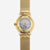 alt
Orologio Naos XS bianco e oro con cinturino Milanaise oro 16, retro grigio