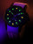 Orologio da uomo con quadrante luminoso, cassa nera e cinturino nero