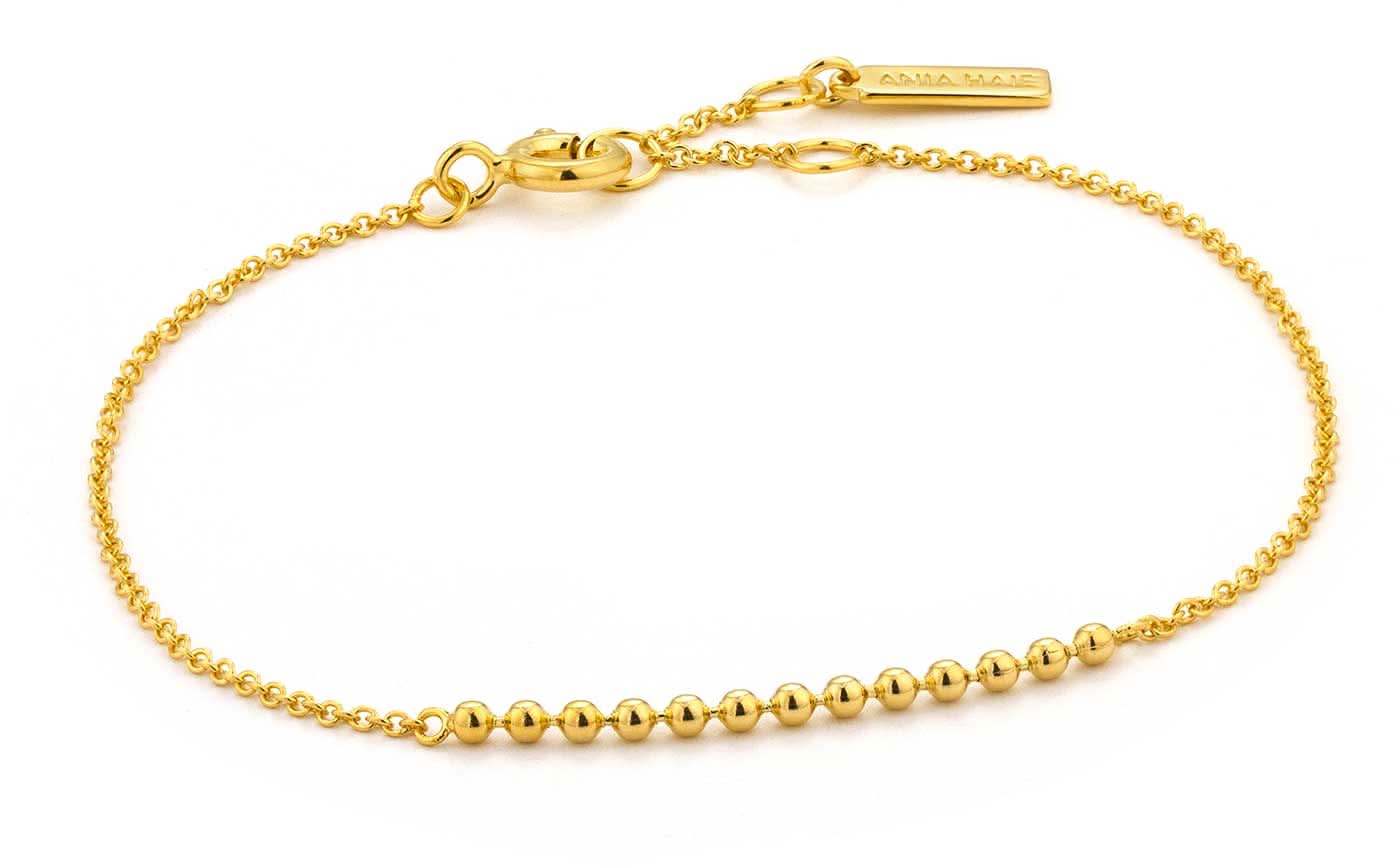 Bracciale color oro con piccole sfere e chiusura a catena