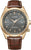 Herrenuhr mit braunem Lederarmband, goldfarbener Lünette und dunklem Zifferblatt, Datumsfenster