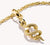 "Ciondolo Charm Thomas Sabo, serpente con pietra bianca, in argento dorato"