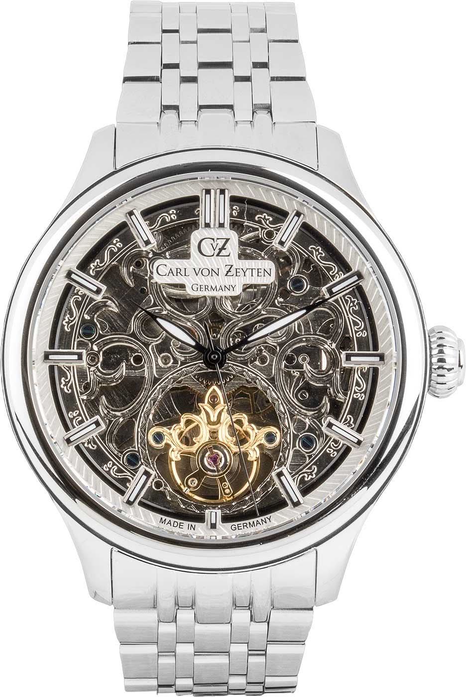 Skelettierte Herrenuhr mit Metallband, silberfarbenem Zifferblatt und goldener Mechanik