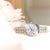 Orologio da donna con bracciale in acciaio inossidabile color argento e quadrante in madreperla chiaro, lancetta blu