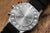 Retro della orologio da polso da uomo Vostok Europe con cassa argentata e cinturino nero