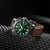Orologio da uomo con quadrante verde, lunetta argentata e cinturino in pelle marrone