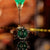 Orologio da uomo con quadrante verde, cinturino in pelle marrone e cassa argentata