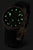 "Orologio da donna con punti luminescenti sul quadrante, quadrante nero e cinturino in pelle nera"