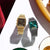 Casio Armbanduhren im Duo: goldfarbenes und dunkelgraues Metallarmband, grünes bzw. schwarzes Zifferblatt