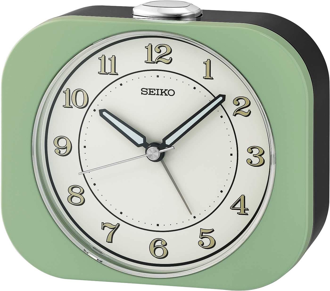 Sveglia classica Seiko con cassa in plastica verde, quadrante bianco rotondo e lancette analogiche