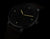 Orologio da uomo con quadrante nero, indici luminescenti e lancette colorate