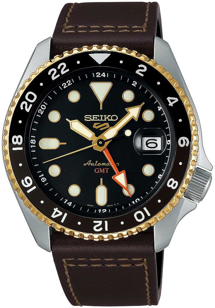 Orologio da uomo con quadrante nero, lunetta color oro e cinturino in pelle marrone.