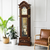 Orologio a pendolo da terra in legno con quadrante rotondo e pendolo in vetro