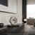 Holz-Tischuhr in klarem Glasbox mit rundem Zifferblatt und sichtbarem Uhrwerk