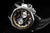 Orologio da uomo con quadrante nero, cassa color argento e cinturino in pelle