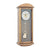 Orologio da parete con cassa in legno color ghianda, quadrante blu-grigio e motivo a pendolo