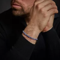 Bracciale in pietre preziose a forma di disco nei toni...